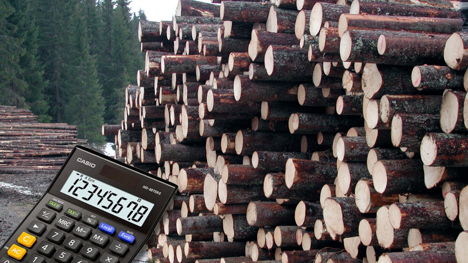 kalkulator foran tømmerlunne.